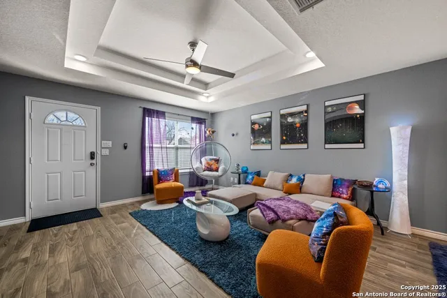 a bedroom with furniture and wooden floor