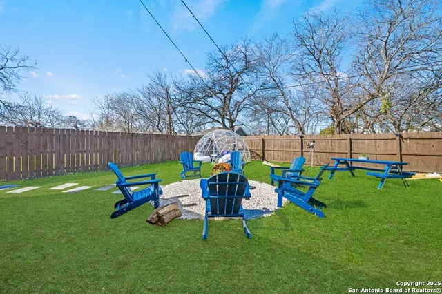 a backyard of a house with lots of green space
