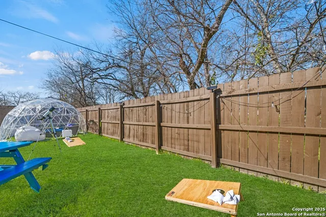 a house view with a sitting space and garden