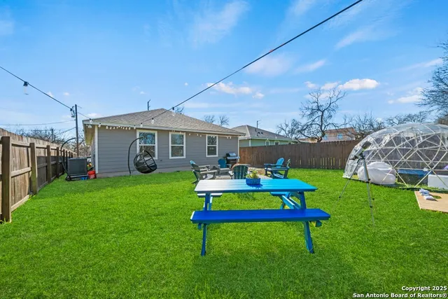 a view of an chairs and table in the garden