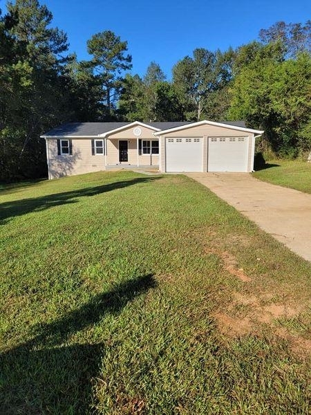 2407 Daniel Road Villa Rica, GA 30180 - Photo 1 of 1 a front view of a house with a yard