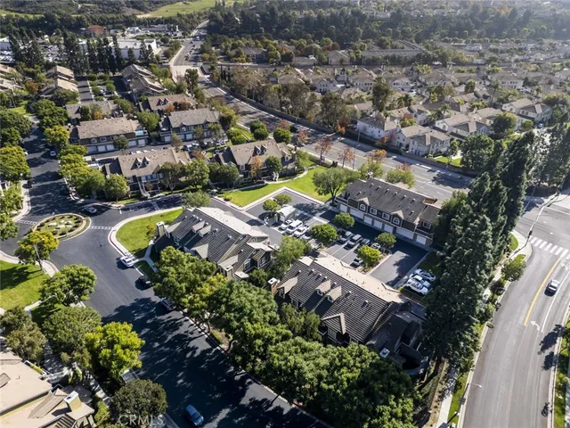 an aerial view of residential house with outdoor space and swimming pool