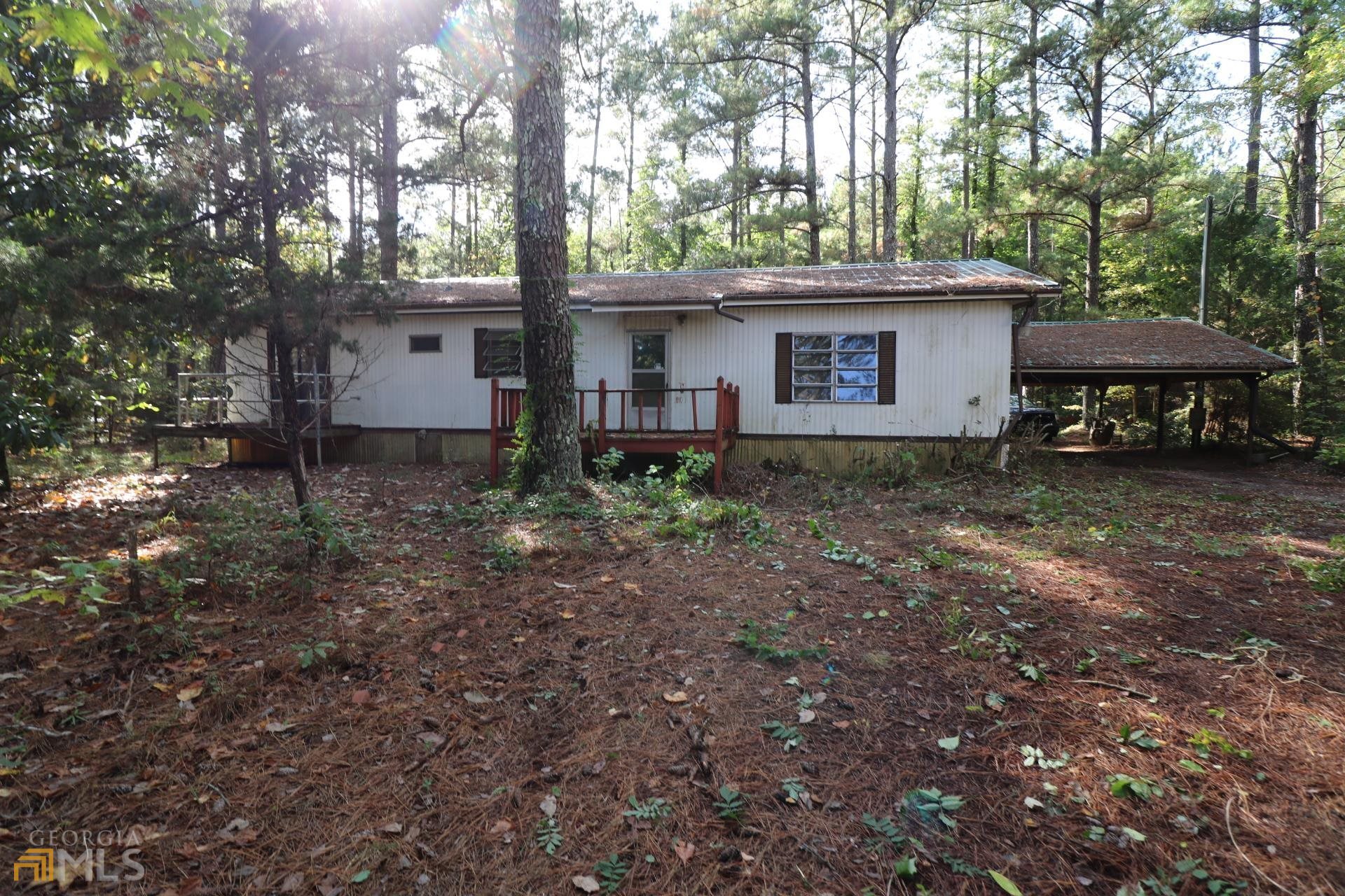 380 B Boynton Road Hampton, GA 30228 - Photo 1 of 1 a view of a house with a yard and sitting area