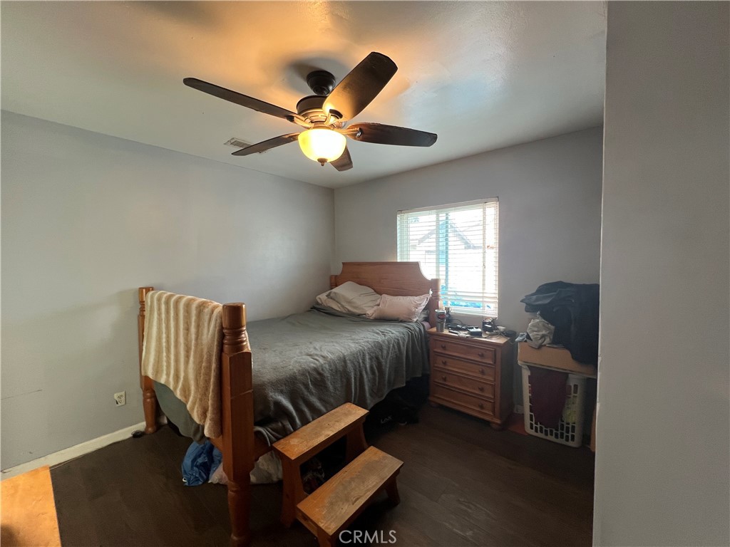 426 West 1st Street Azusa, CA 91702 - Photo 12 of 21 a bedroom with a bed and a chandelier