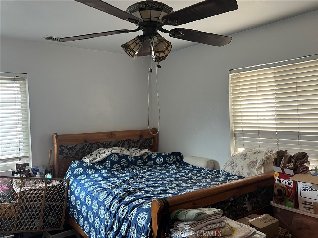 426 West 1st Street Azusa, CA 91702 - Photo 15 of 21 a bedroom with a bed and window