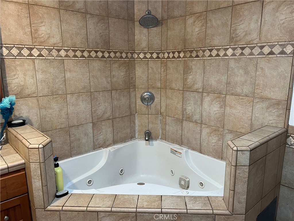 426 West 1st Street Azusa, CA 91702 - Photo 16 of 21 a bathroom with a tub and a shower