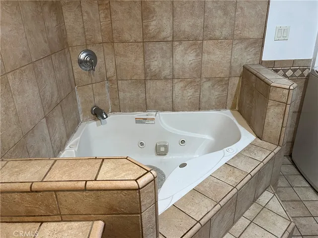 a bathroom with a bathtub and shower