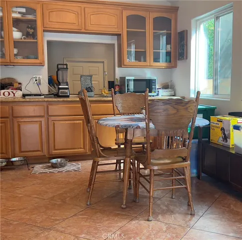 a view of a dining table and chairs in the patio