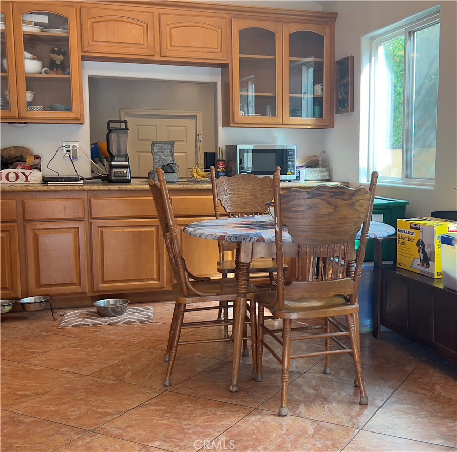 426 West 1st Street Azusa, CA 91702 - Photo 7 of 21 a view of a dining table and chairs in the patio