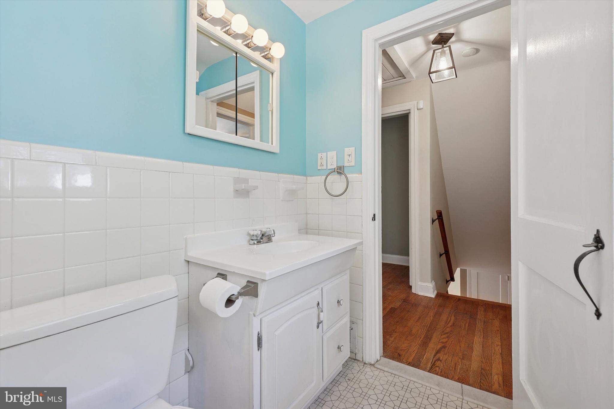 237 Crosshill Road Wynnewood, PA 19096 - Photo 19 of 40 a bathroom with a sink a vanity and a mirror