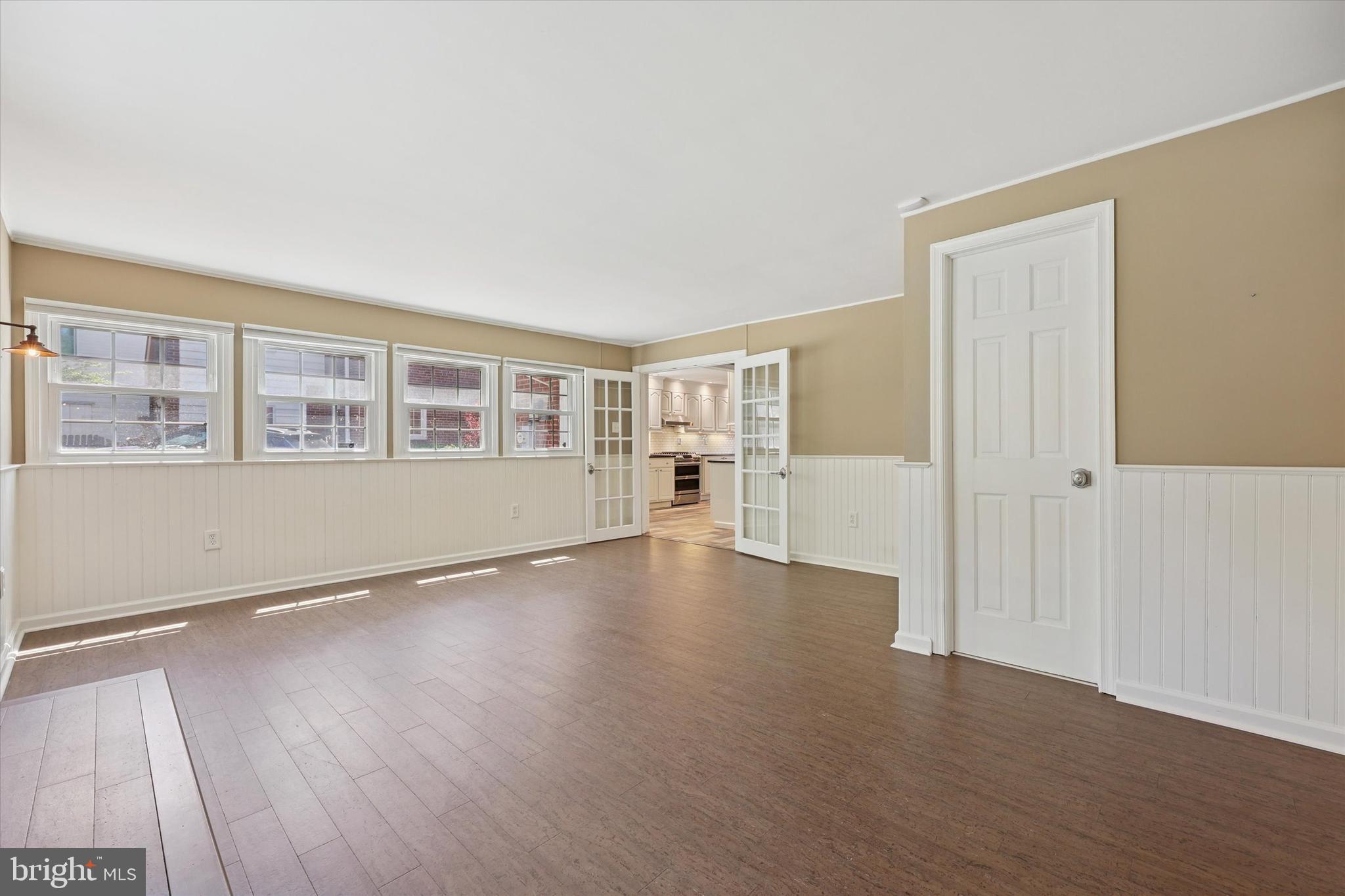 237 Crosshill Road Wynnewood, PA 19096 - Photo 7 of 40 an empty room with wooden floor and windows