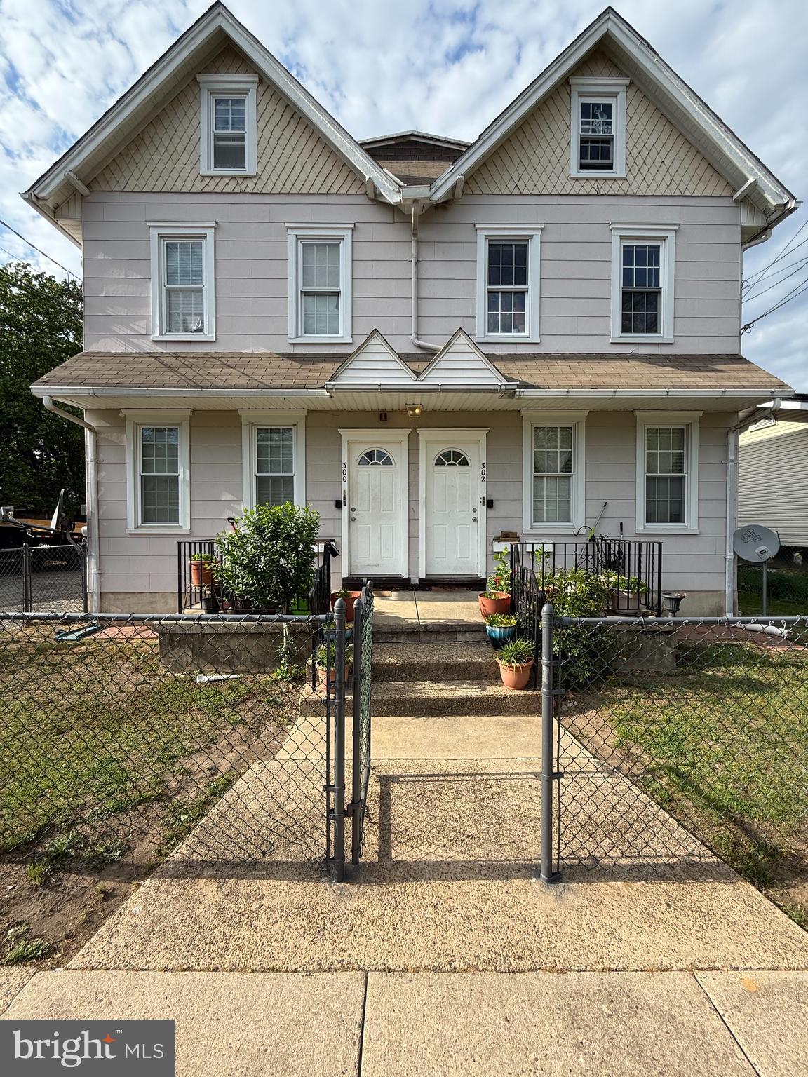 300 Washington Street, Unit A Delanco, NJ 08075 - Photo 1 of 4 a front view of a house with garden