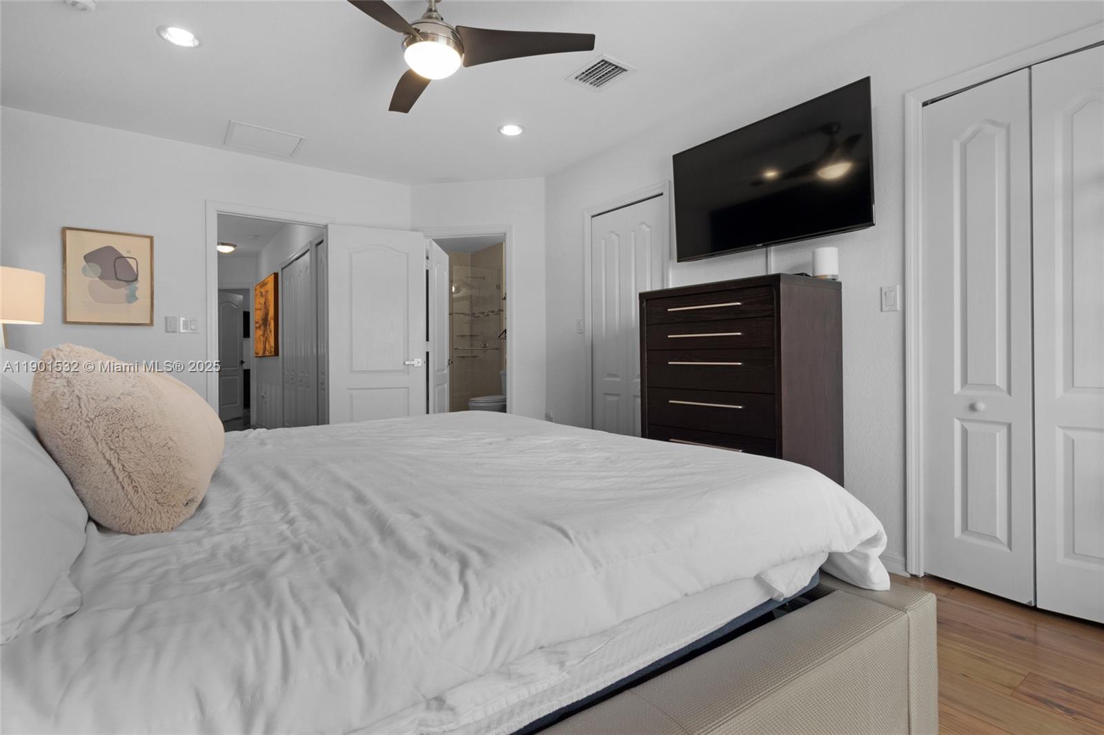 12905 Southwest 31st Court Miramar, FL 33027 - Photo 19 of 48 a bedroom with a bed and a flat screen tv