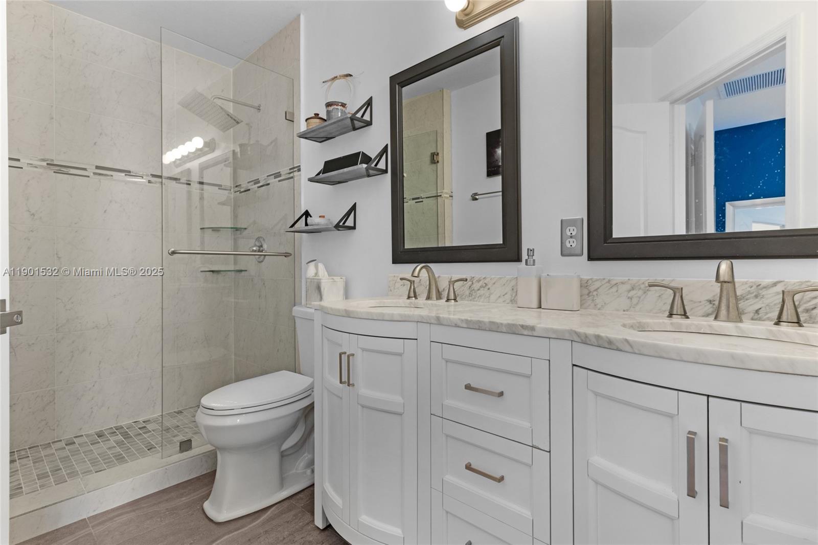 12905 Southwest 31st Court Miramar, FL 33027 - Photo 21 of 48 a bathroom with a sink a toilet and shower