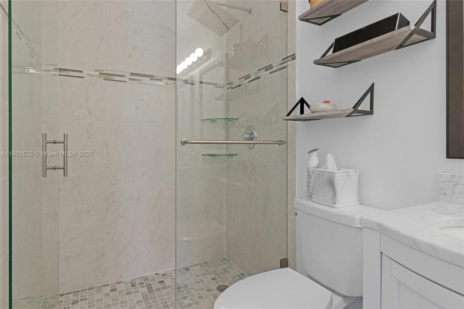 12905 Southwest 31st Court Miramar, FL 33027 - Photo 23 of 48 a bathroom with a granite countertop shower sink vanity and toilet