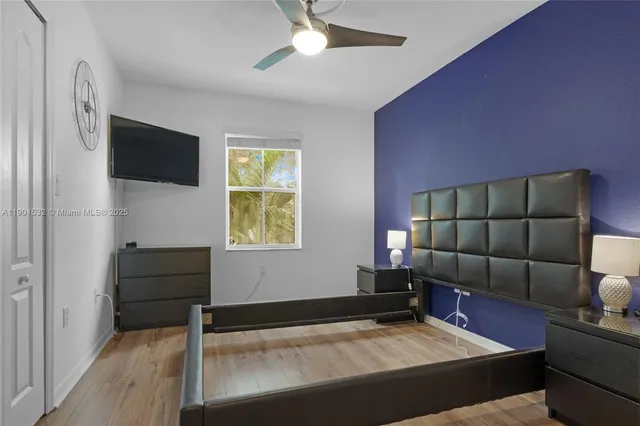 a bedroom with furniture and a window