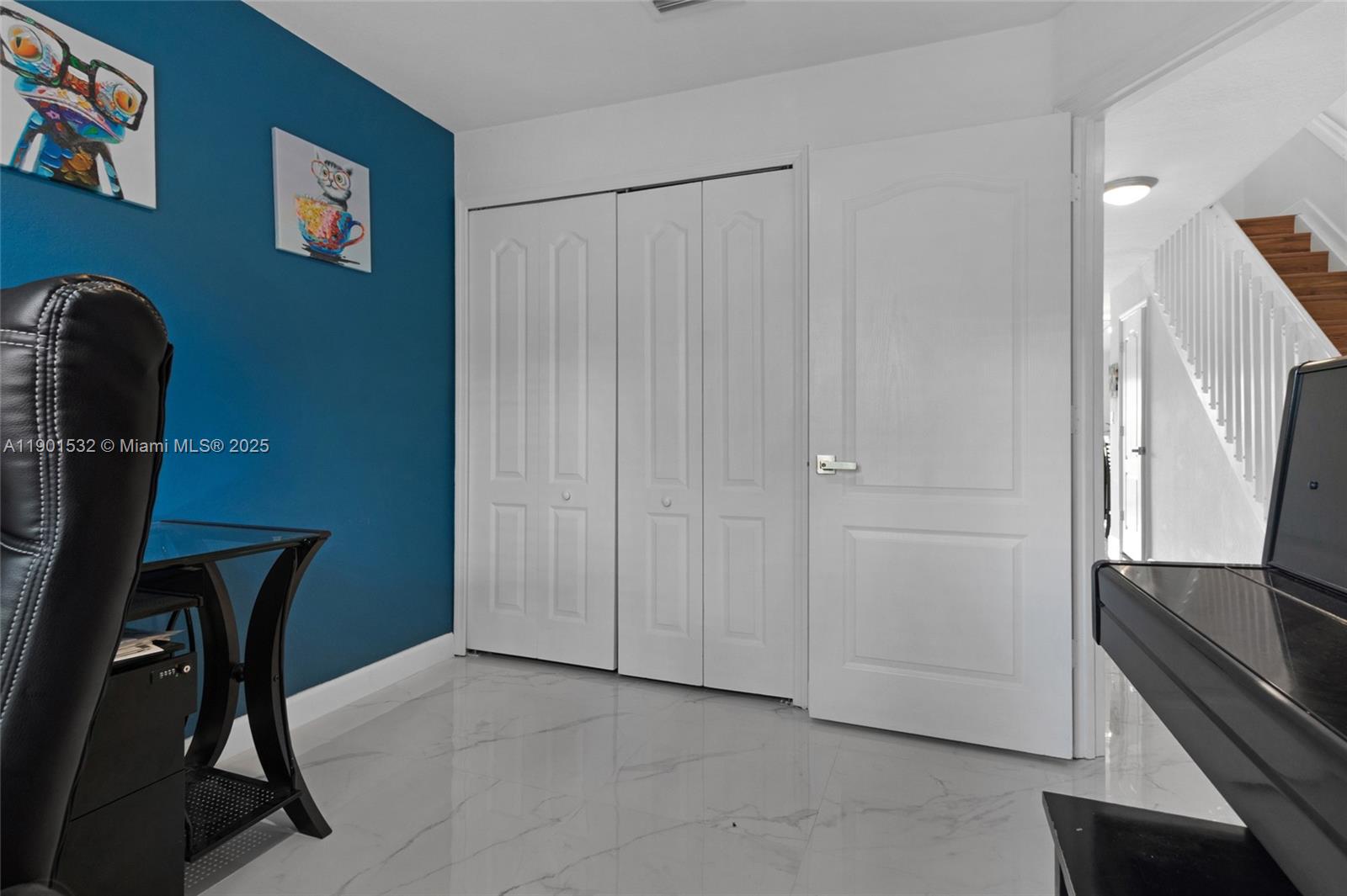 12905 Southwest 31st Court Miramar, FL 33027 - Photo 29 of 48 a view of a workspace with furniture and a refrigerator