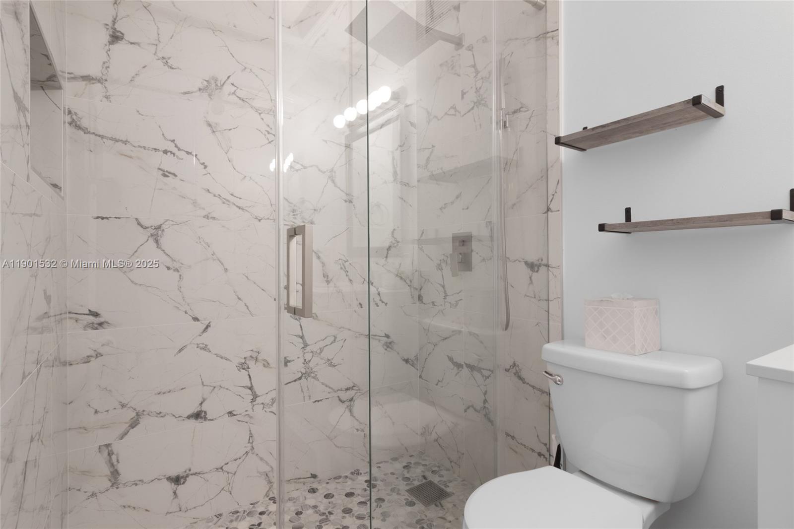 12905 Southwest 31st Court Miramar, FL 33027 - Photo 33 of 48 a white toilet sitting next to a shower