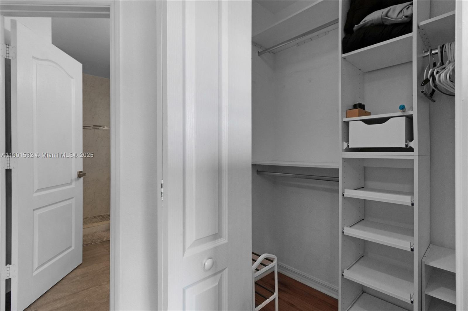 12905 Southwest 31st Court Miramar, FL 33027 - Photo 34 of 48 a view of walk in closet with empty racks