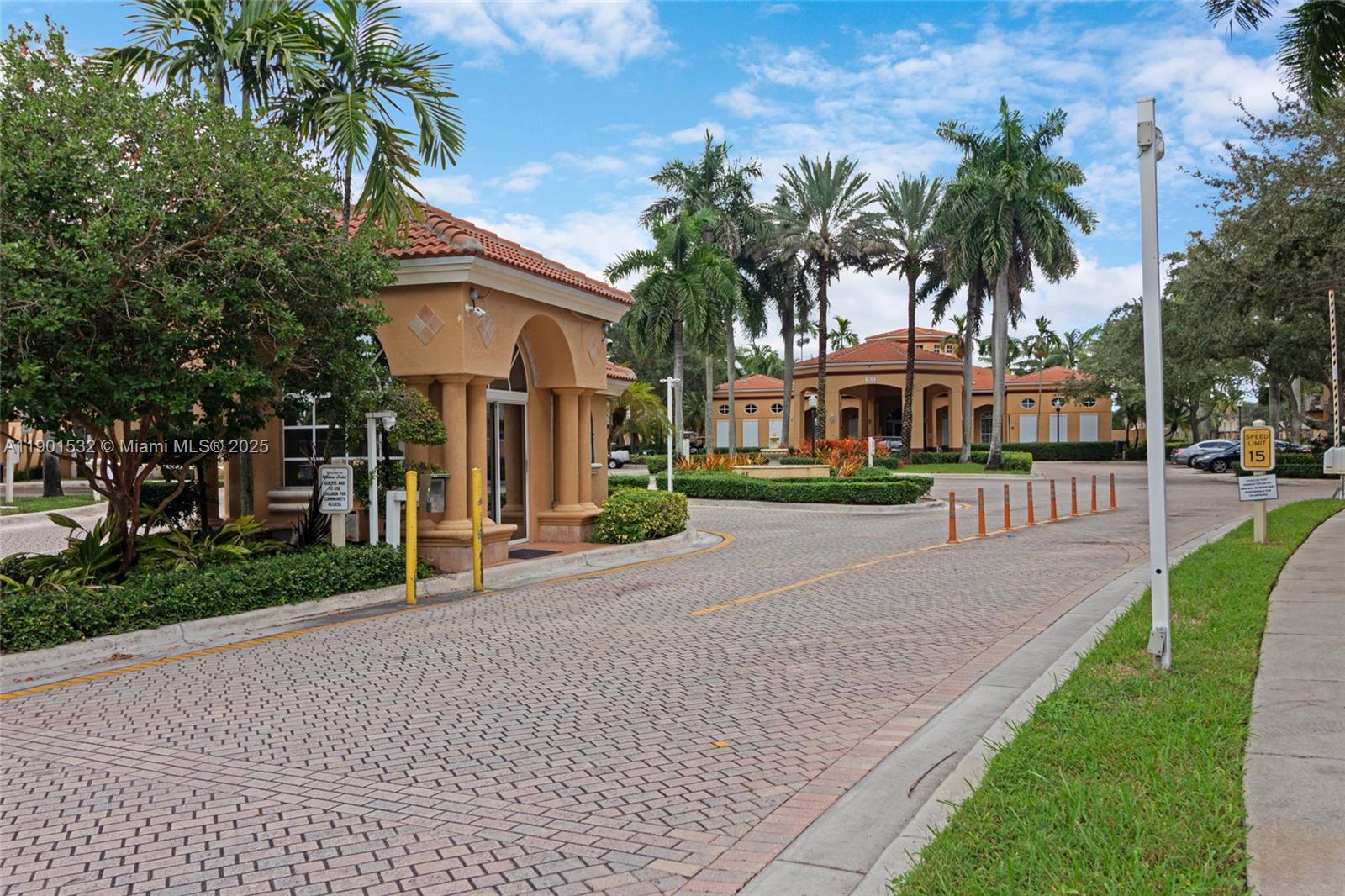 12905 Southwest 31st Court Miramar, FL 33027 - Photo 44 of 48 a front view of a house with a yard and palm trees