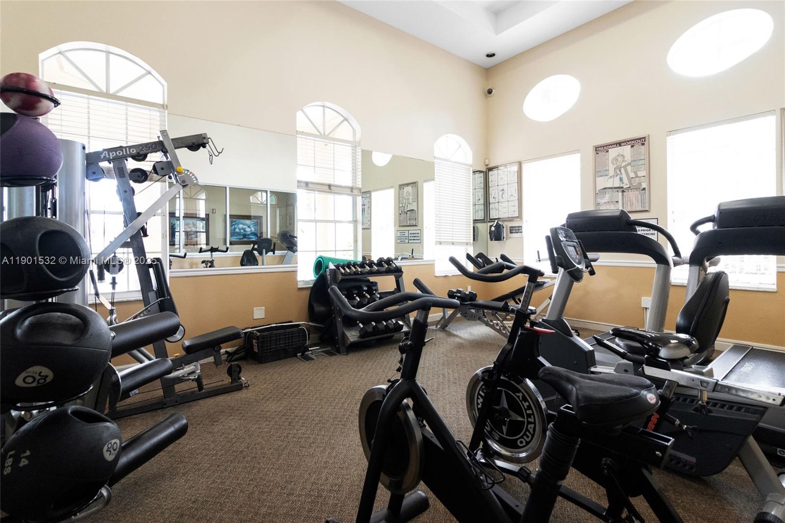 12905 Southwest 31st Court Miramar, FL 33027 - Photo 48 of 48 a room with gym equipment and wooden floor