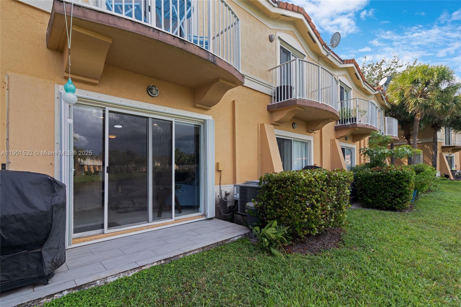 12905 Southwest 31st Court Miramar, FL 33027 - Photo 8 of 48 a front view of a house with a garden