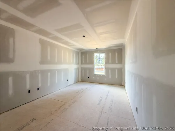 a view of a livingroom with an empty space and window
