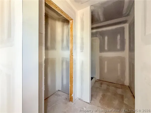 a view of a bathroom from a hallway