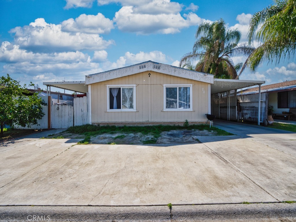 700 South Shafter, Unit 20 Shafter, CA 93263 - Photo 18 of 18 a front view of a house with a yard and garage