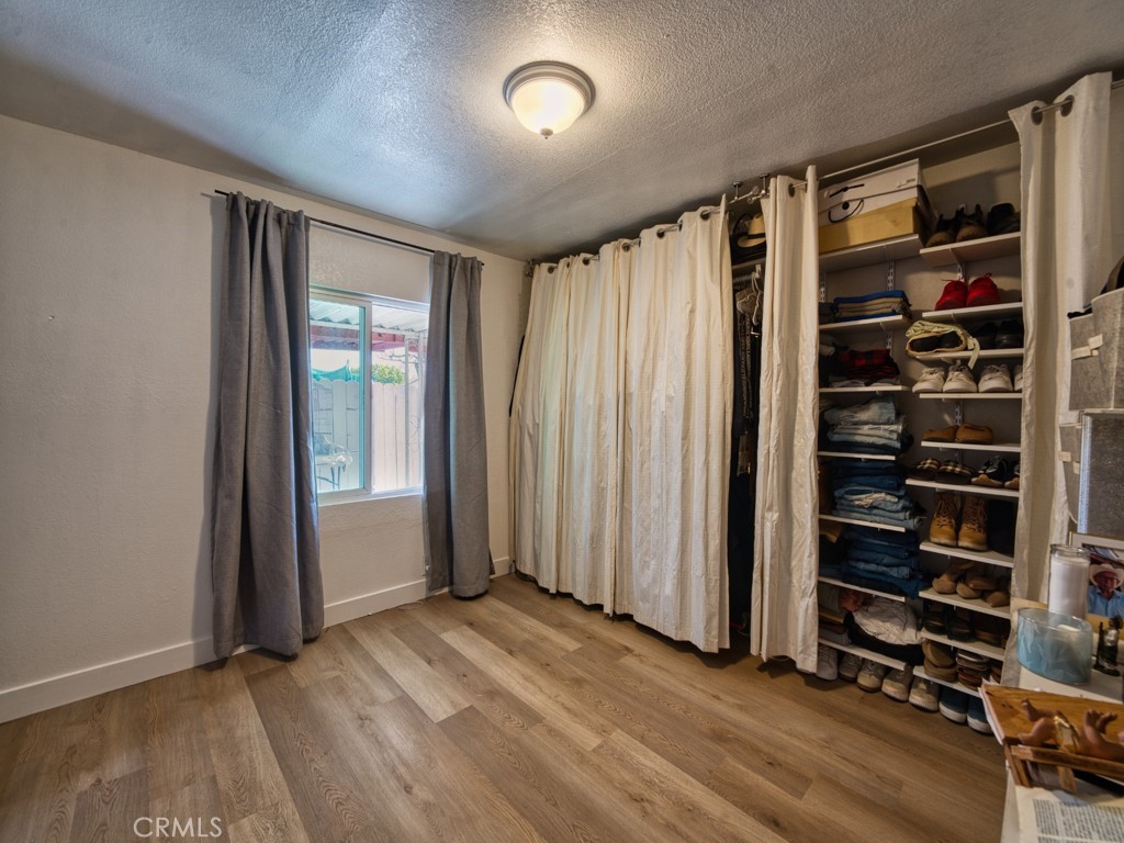 700 South Shafter, Unit 20 Shafter, CA 93263 - Photo 9 of 18 wooden floor in an empty room with a window