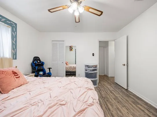 a bed room with a bed and a chandelier
