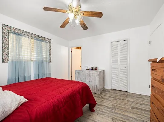 a bed room with a bed and a chandelier