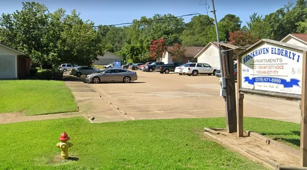 a view of street with parked cars