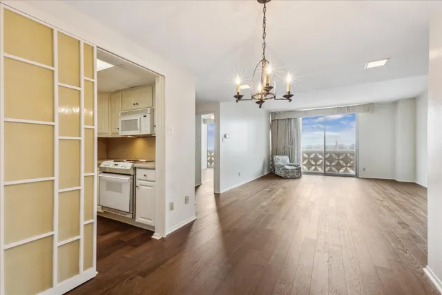 a view of a kitchen cabinets and wooden floor