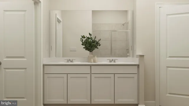 a bathroom with a sink and vanity