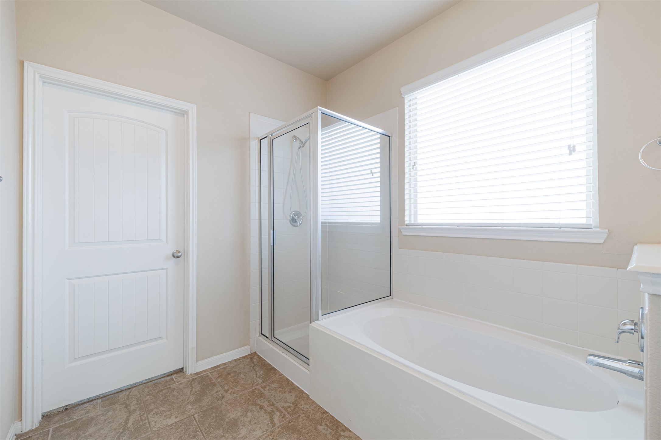 25322 Saddlebrook Ranch Drive Tomball, TX 77375 - Photo 12 of 20 a white bath tub sitting next to a window