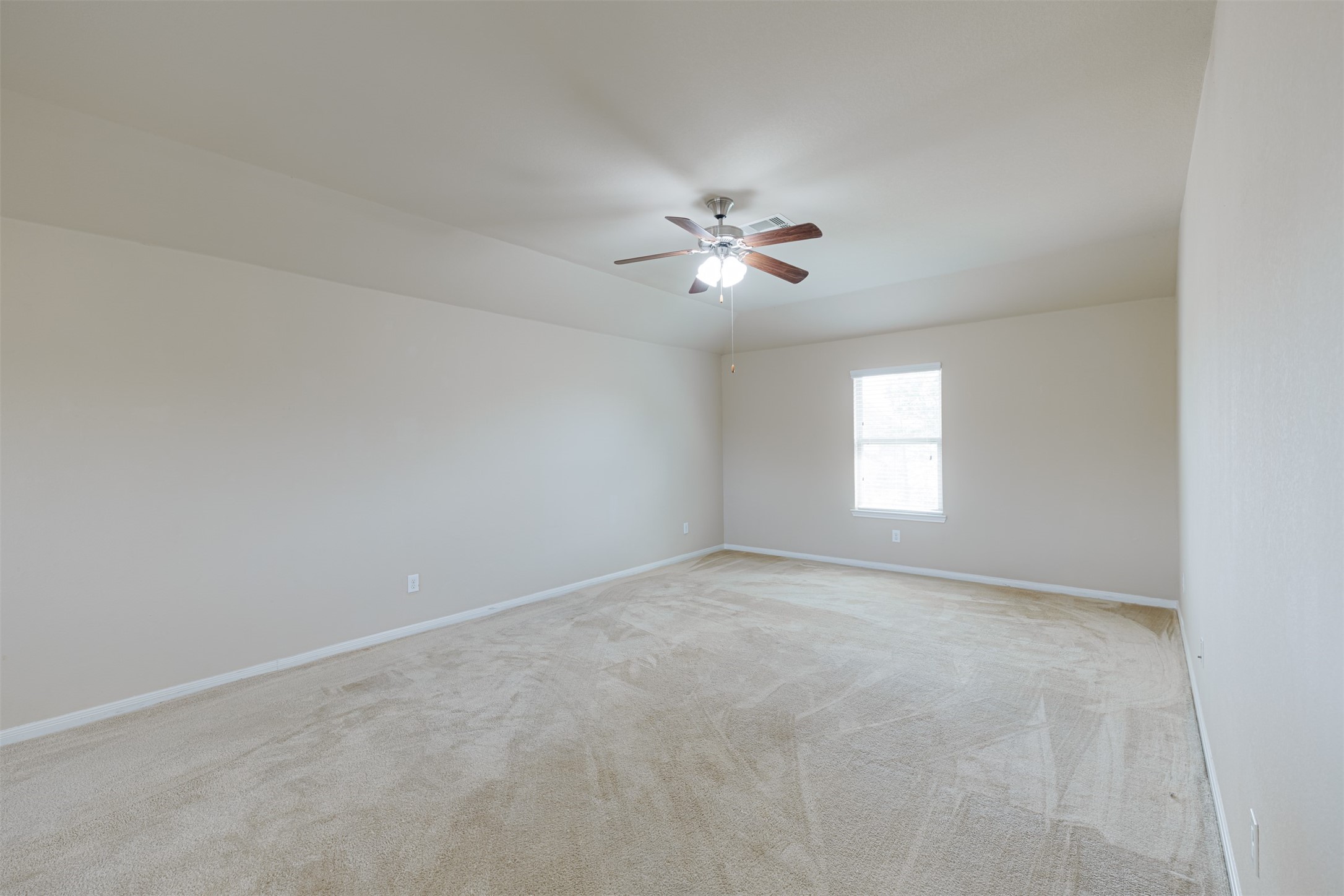 25322 Saddlebrook Ranch Drive Tomball, TX 77375 - Photo 13 of 20 a view of an empty room with a window