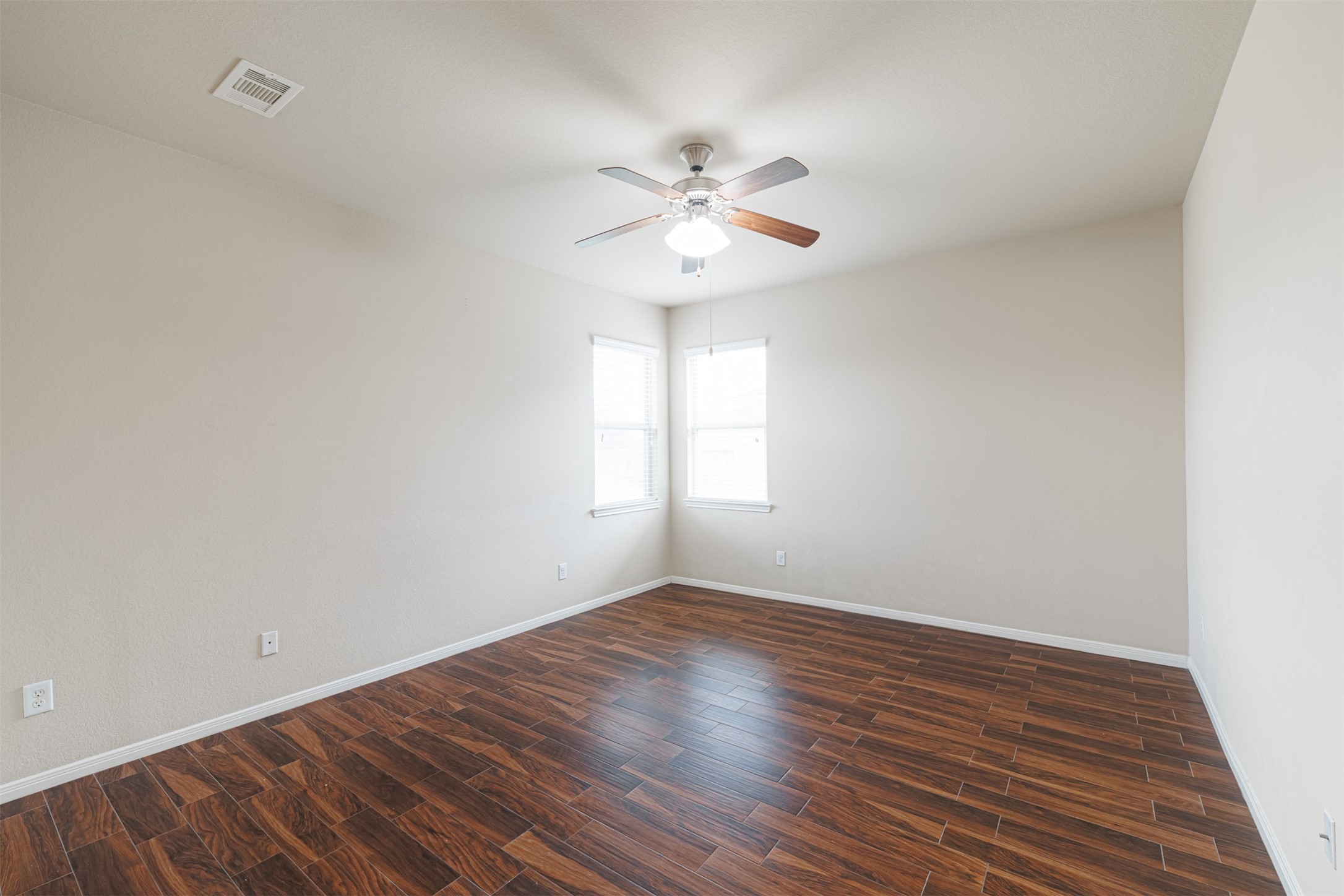 25322 Saddlebrook Ranch Drive Tomball, TX 77375 - Photo 9 of 20 a view of an empty room with wooden floor and a window