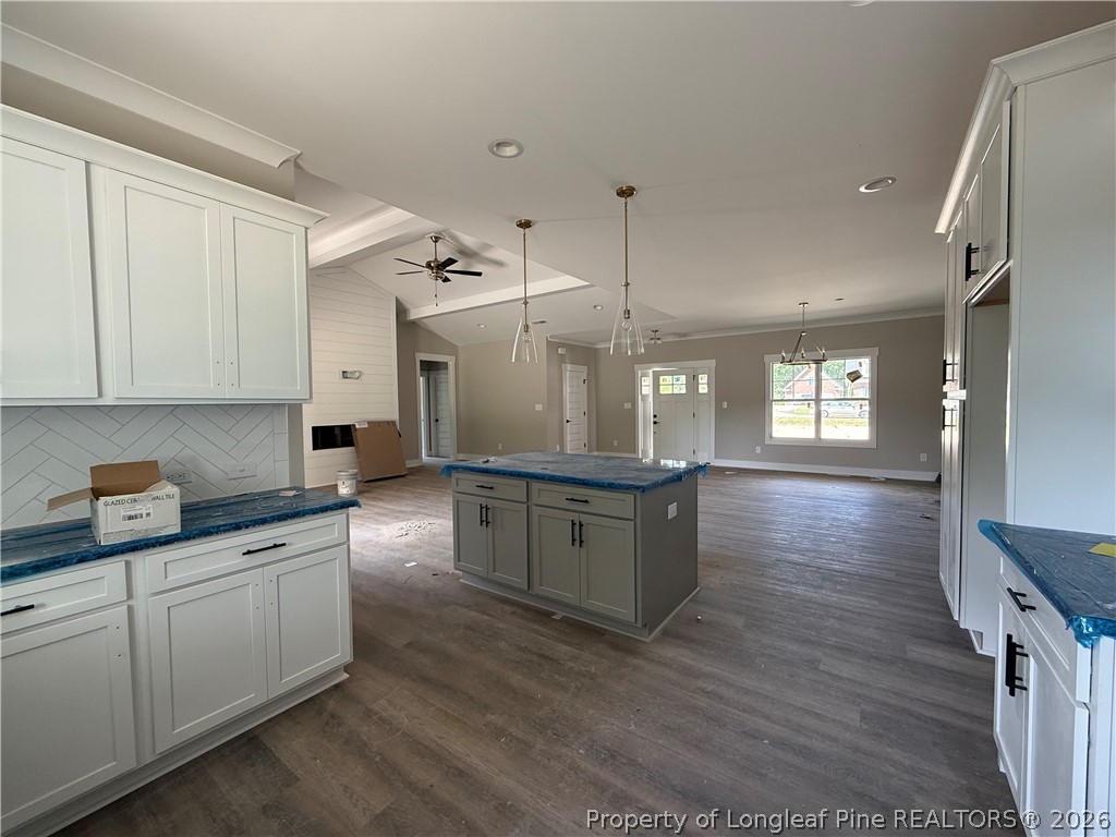 132 Ridge Stone Drive Autryville, NC 28318 - Photo 8 of 26 a large kitchen with granite countertop a large counter top appliances and cabinets