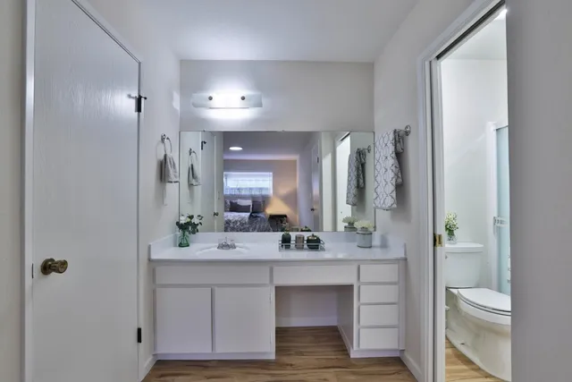 a bathroom with a double vanity sink and a mirror