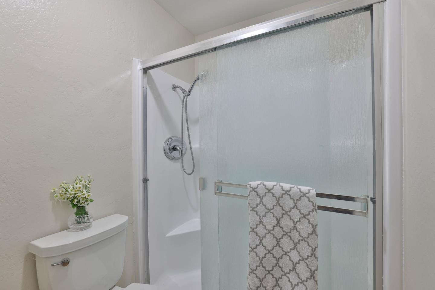 4648 Cherry Avenue San Jose, CA 95118 - Photo 15 of 29 a bathroom with a shower and a toilet