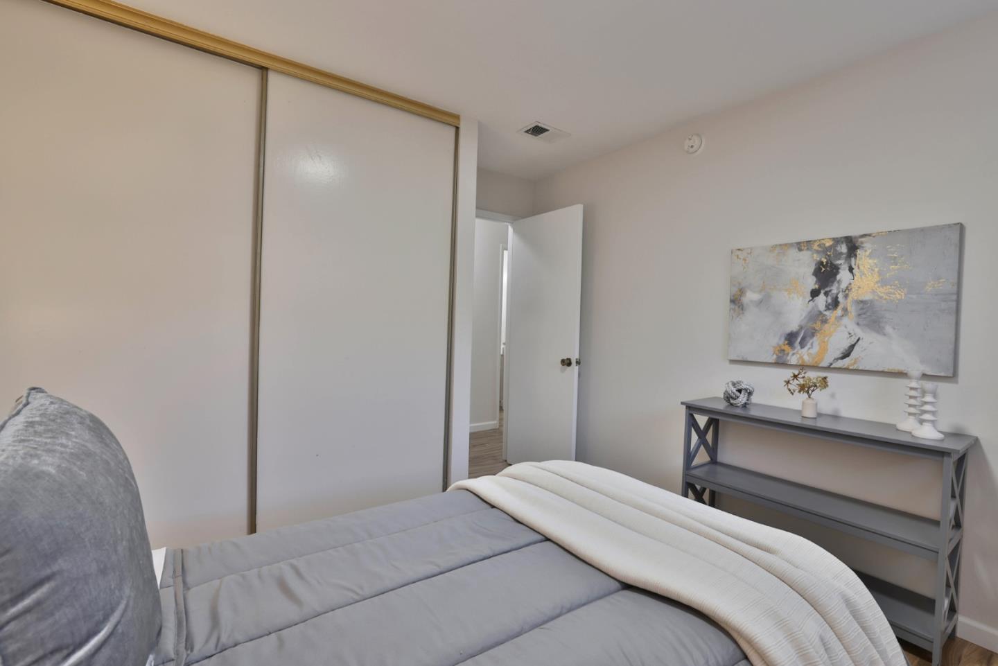4648 Cherry Avenue San Jose, CA 95118 - Photo 18 of 29 a bedroom with a bed and a painting on the wall