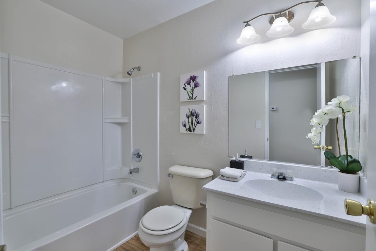 4648 Cherry Avenue San Jose, CA 95118 - Photo 21 of 29 a bathroom with a sink a toilet and shower