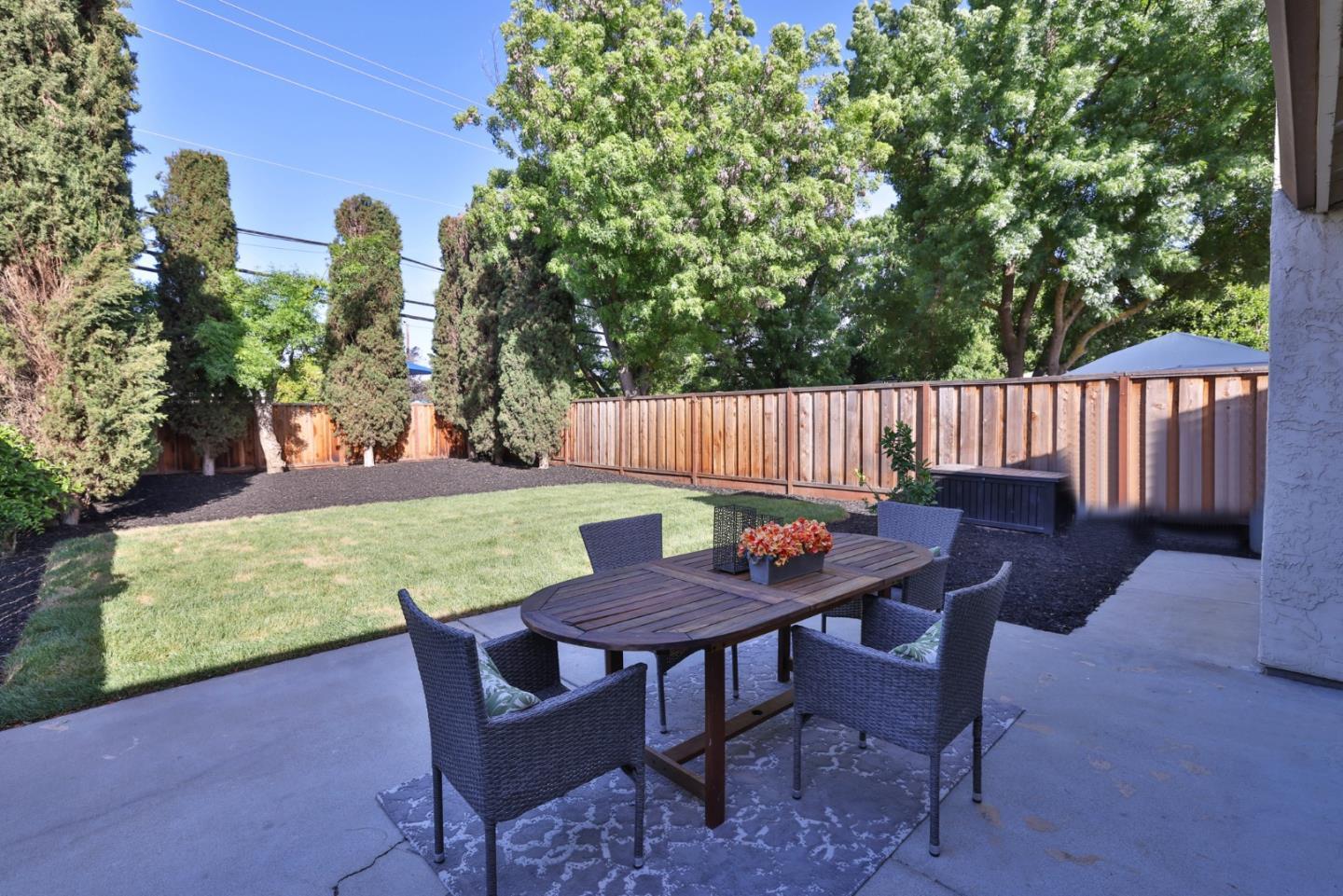 4648 Cherry Avenue San Jose, CA 95118 - Photo 23 of 29 a view of a chairs and table in the back yard of the house