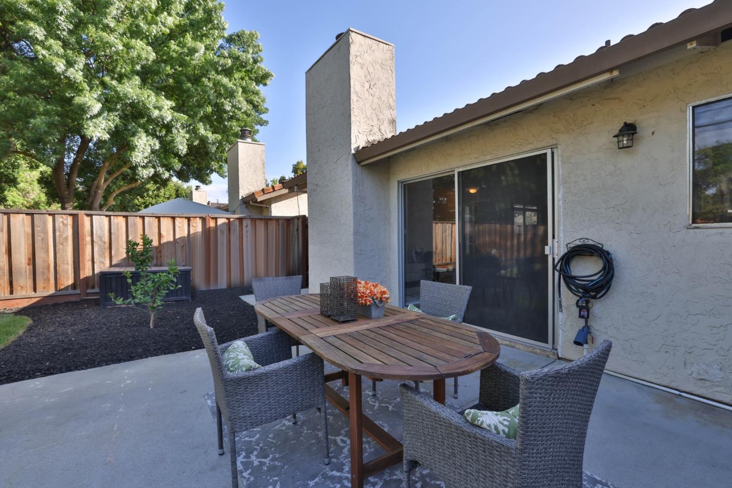 4648 Cherry Avenue San Jose, CA 95118 - Photo 24 of 29 a view of a table and chairs in back yard of the house