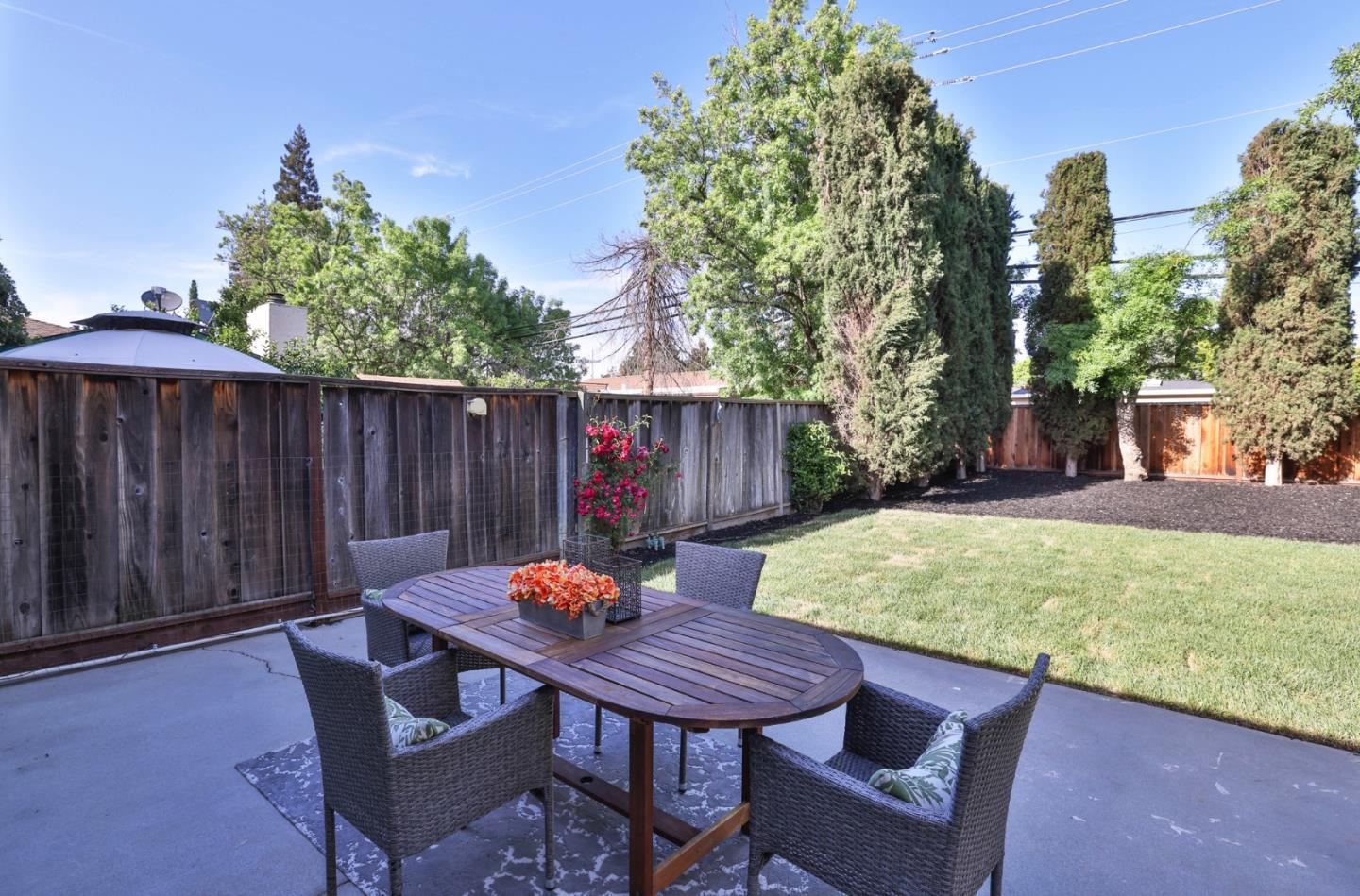 4648 Cherry Avenue San Jose, CA 95118 - Photo 25 of 29 a backyard of a house with table and chairs