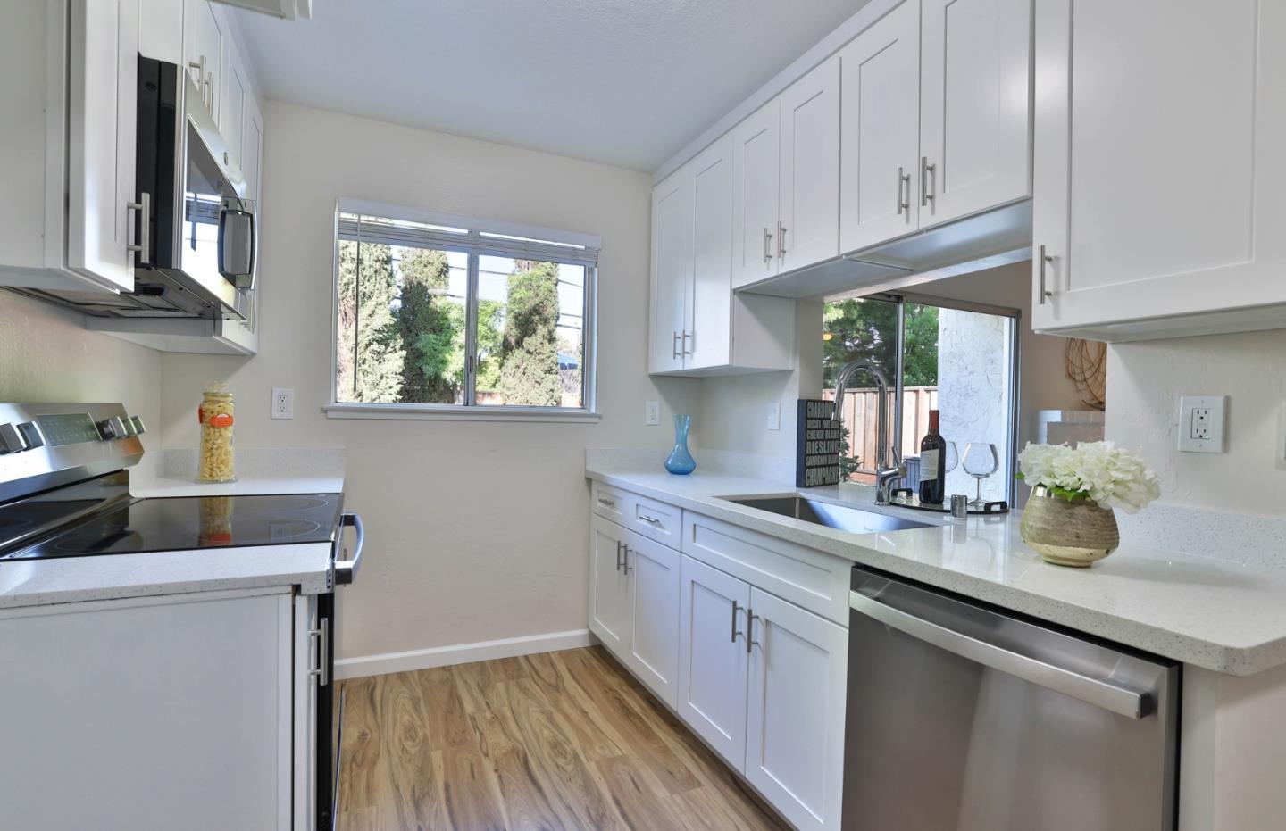 4648 Cherry Avenue San Jose, CA 95118 - Photo 8 of 29 a kitchen with a sink cabinets and window