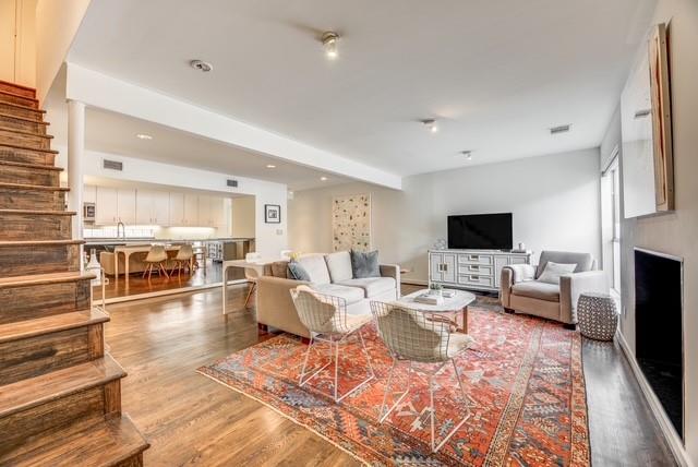 a living room with lots of furniture and a flat screen tv