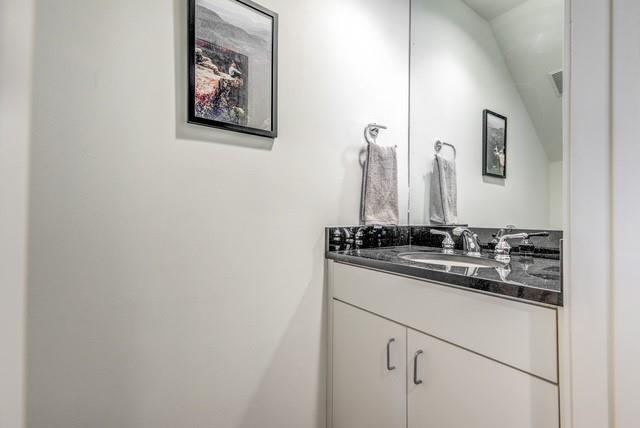 4122 Travis Street, Unit 2 Dallas, TX 75204 - Photo 15 of 19 a bathroom with a sink and a mirror