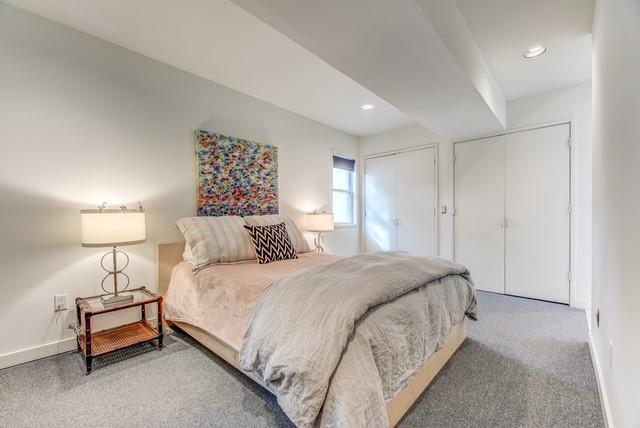 4122 Travis Street, Unit 2 Dallas, TX 75204 - Photo 8 of 19 a bedroom with a bed and a lamp